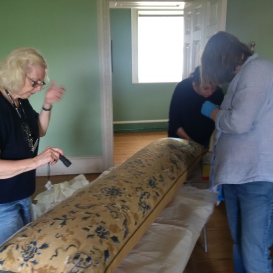 Bolster inspection by Lisa, Jo and volunteer (image: Laura Brooks)
